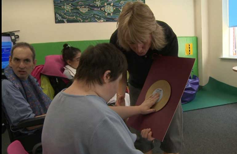 Photograph of a storytelling session in an adult day centre